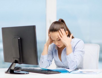 photodune-7064563-stressed-woman-with-computer-and-documents-s